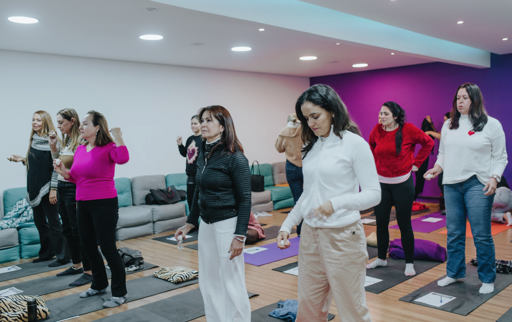 Group standing and breathing together during a session